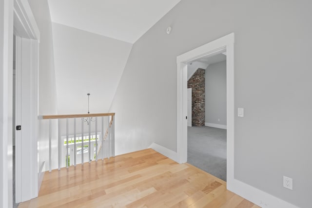 246 Coombs Rd, Brunswick, ME 04011 - empty room featuring vaulted ceiling, wood finished floors, and baseboards