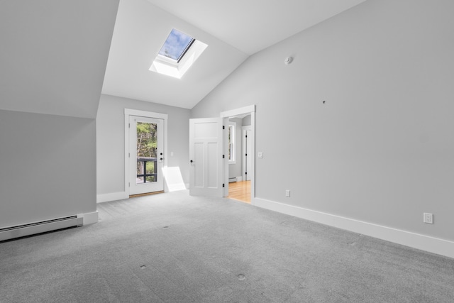 246 Coombs Rd, Brunswick, ME 04011 - spare room with a skylight, vaulted ceiling, baseboards, carpet, and baseboard heating