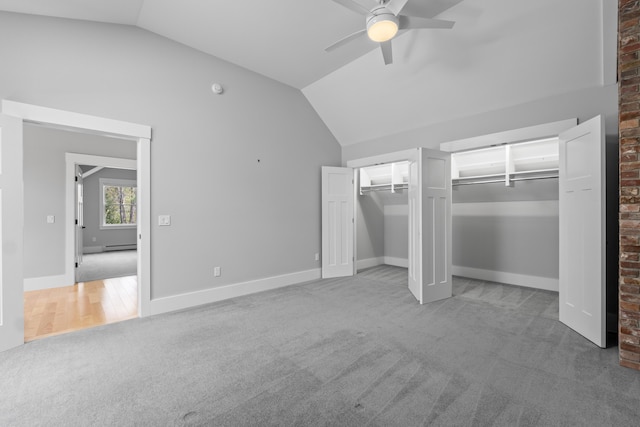 246 Coombs Rd, Brunswick, ME 04011 - unfurnished bedroom featuring carpet, vaulted ceiling, multiple closets, a ceiling fan, and baseboards