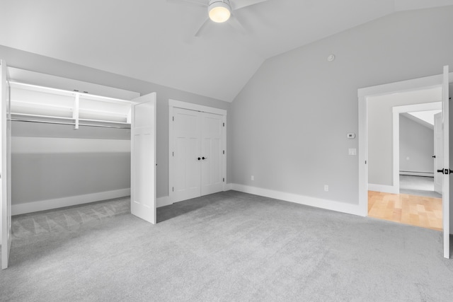 246 Coombs Rd, Brunswick, ME 04011 - unfurnished bedroom with carpet, lofted ceiling, baseboard heating, baseboards, and ceiling fan