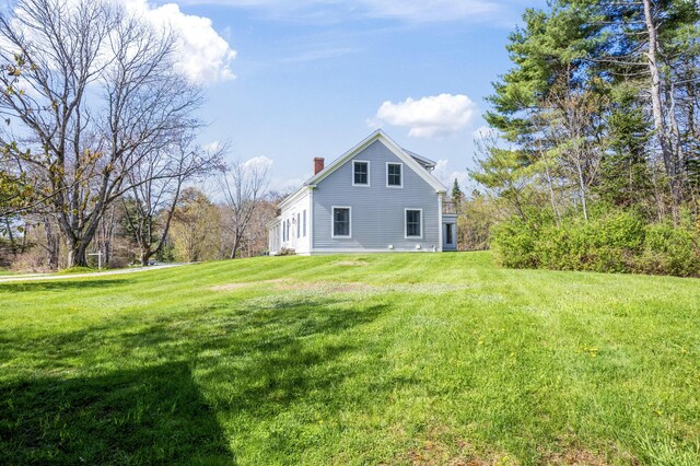 246 Coombs Rd, Brunswick, ME 04011 - view of home's exterior featuring a chimney and a lawn