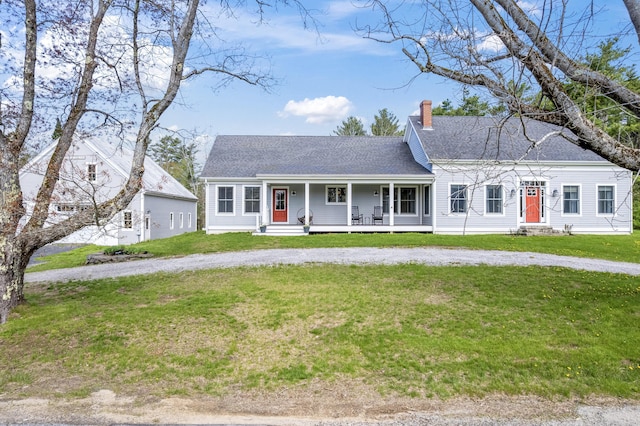 246 Coombs Rd, Brunswick, ME 04011 - view of front of property featuring a chimney, a porch, a front lawn, and roof with shingles
