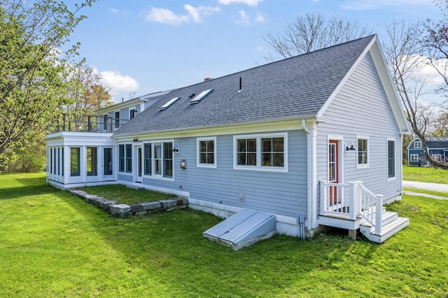 246 Coombs Rd, Brunswick, ME 04011 - back of house featuring a balcony, roof with shingles, and a yard