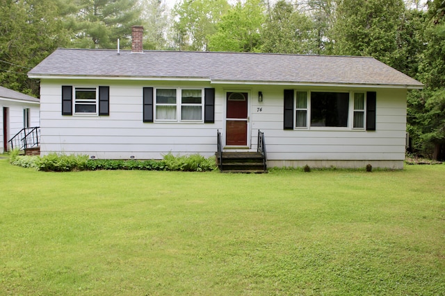 74 Fields Pond Rd, Holden, ME 04429 - single story home featuring entry steps, roof with shingles, a front yard, and a chimney