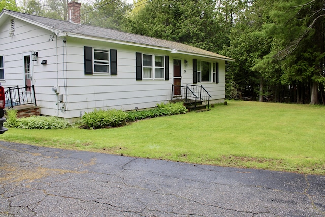 74 Fields Pond Rd, Holden, ME 04429 - ranch-style home featuring a chimney, a front lawn, and roof with shingles