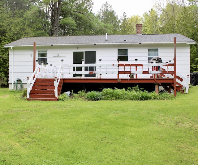 74 Fields Pond Rd, Holden, ME 04429 - rear view of property featuring a yard, a chimney, a deck, and a shingled roof
