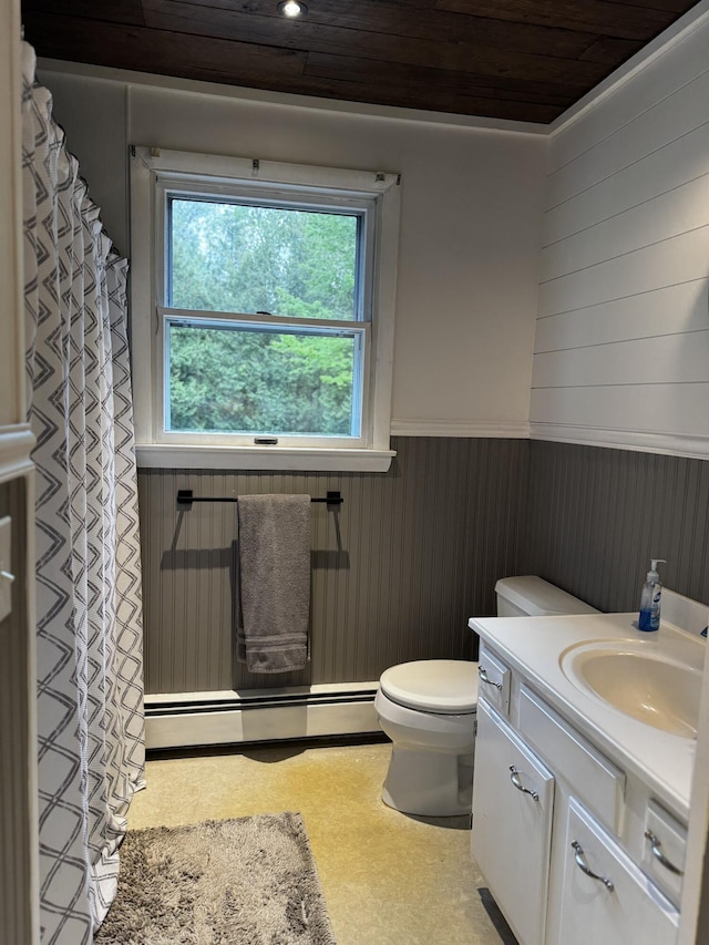 74 Fields Pond Rd, Holden, ME 04429 - full bathroom with a wainscoted wall, a baseboard radiator, wooden ceiling, toilet, and vanity