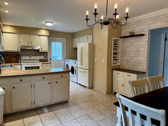 74 Fields Pond Rd, Holden, ME 04429 - kitchen with white appliances, washing machine and clothes dryer, under cabinet range hood, wood walls, and a sink