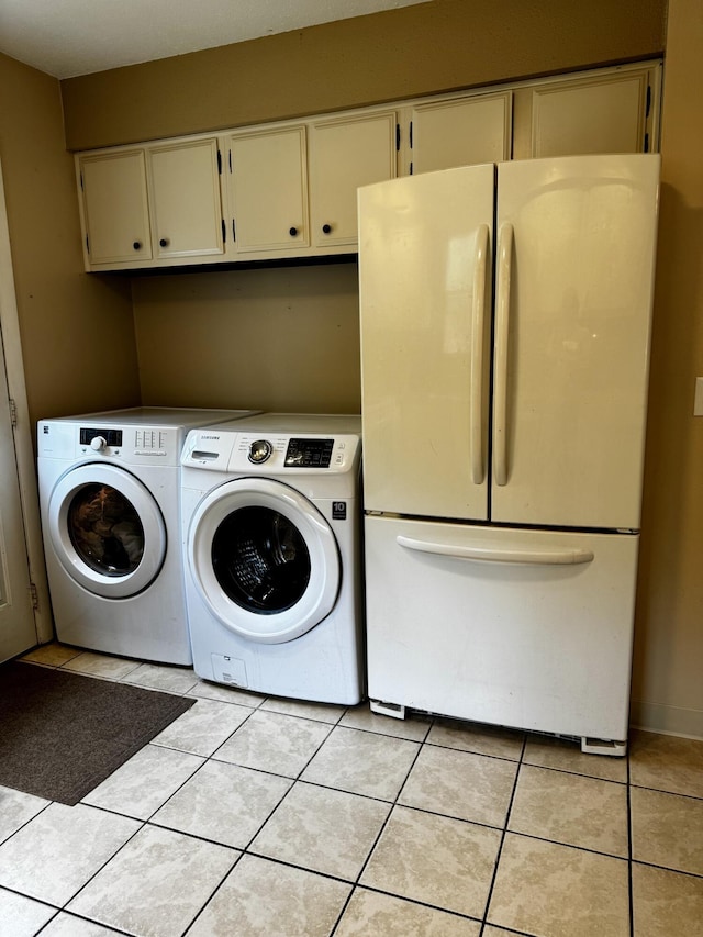 74 Fields Pond Rd, Holden, ME 04429 - laundry room with independent washer and dryer and light tile patterned floors