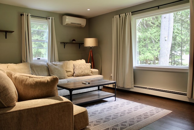 74 Fields Pond Rd, Holden, ME 04429 - living area featuring a wall mounted AC, dark wood-style floors, recessed lighting, and a baseboard heating unit