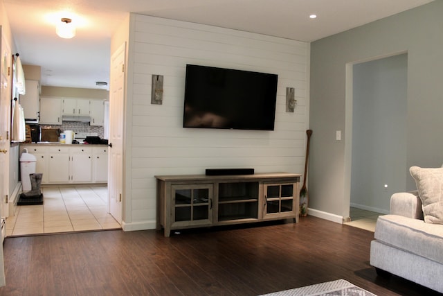 74 Fields Pond Rd, Holden, ME 04429 - living room with wood finished floors, baseboards, and recessed lighting