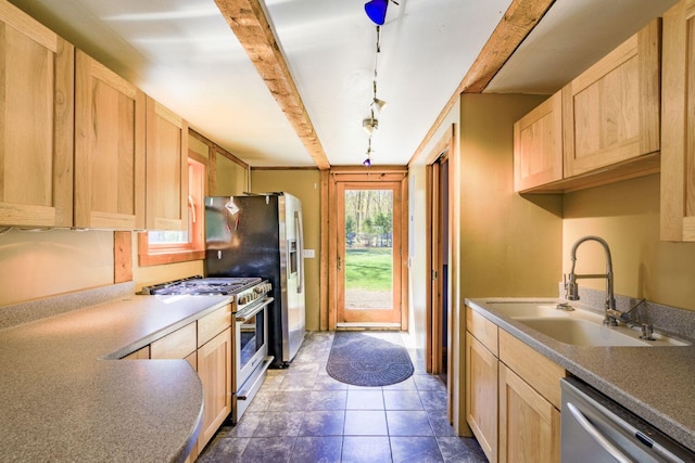 40 Birch Way, Stetson, ME 04488 - kitchen featuring appliances with stainless steel finishes, light brown cabinets, beamed ceiling, and dark tile patterned floors