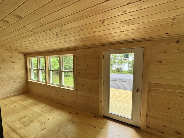 40 Birch Way, Stetson, ME 04488 - entryway with wooden ceiling, wood walls, plenty of natural light, and light wood-style floors