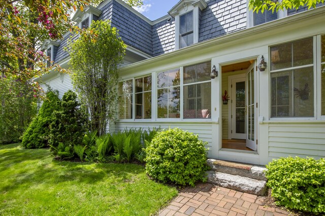 37 Mountain St, Camden, ME 04843 - property entrance featuring mansard roof and a lawn