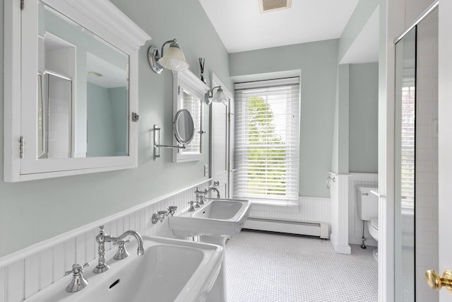 37 Mountain St, Camden, ME 04843 - full bathroom featuring a baseboard radiator, a wainscoted wall, toilet, a sink, and a shower