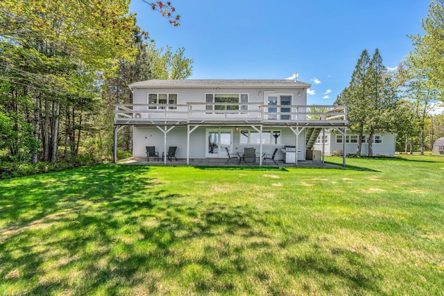 117 Pinkhams Cove Rd, Belgrade, ME 04917 - rear view of house with a wooden deck, a patio, and a yard