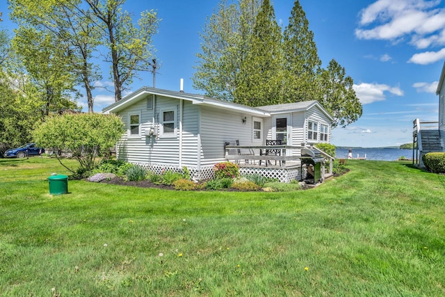 117 Pinkhams Cove Rd, Belgrade, ME 04917 - rear view of property with a lawn and a deck with water view