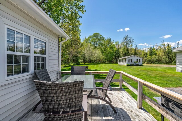 117 Pinkhams Cove Rd, Belgrade, ME 04917 - deck featuring a yard, outdoor dining space, and view of wooded area