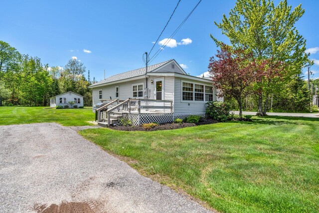 117 Pinkhams Cove Rd, Belgrade, ME 04917 - view of front of house featuring a front yard and a wooden deck