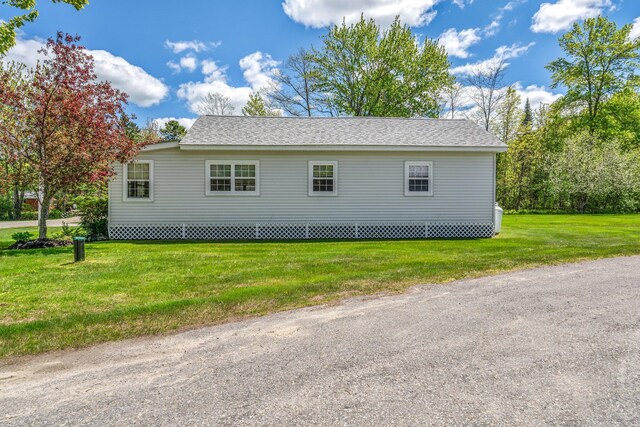 117 Pinkhams Cove Rd, Belgrade, ME 04917 - view of side of property with a yard and a shingled roof