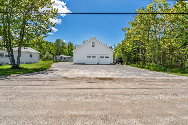 117 Pinkhams Cove Rd, Belgrade, ME 04917 - view of side of property with a detached garage