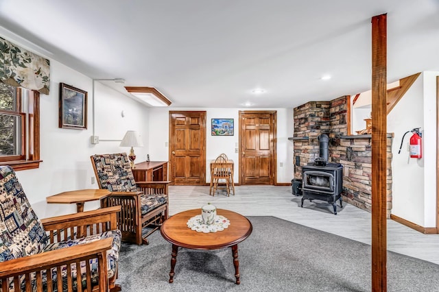 117 Pinkhams Cove Rd, Belgrade, ME 04917 - living area featuring a wood stove and baseboards