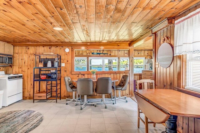 117 Pinkhams Cove Rd, Belgrade, ME 04917 - dining area with wood ceiling, wooden walls, plenty of natural light, and tile patterned floors