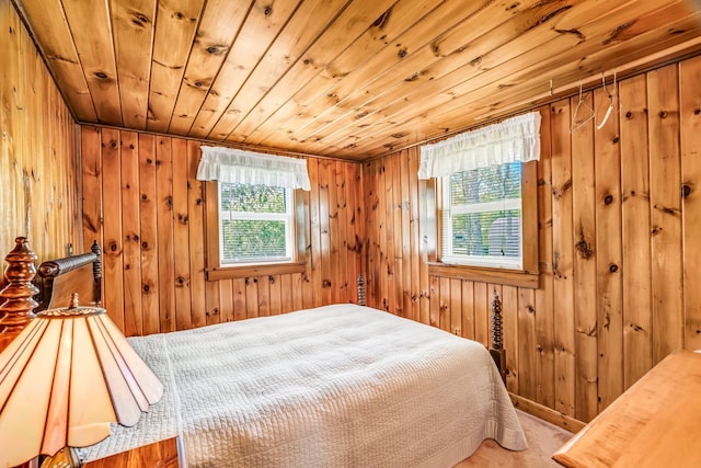 117 Pinkhams Cove Rd, Belgrade, ME 04917 - bedroom featuring wood ceiling, wood walls, and carpet