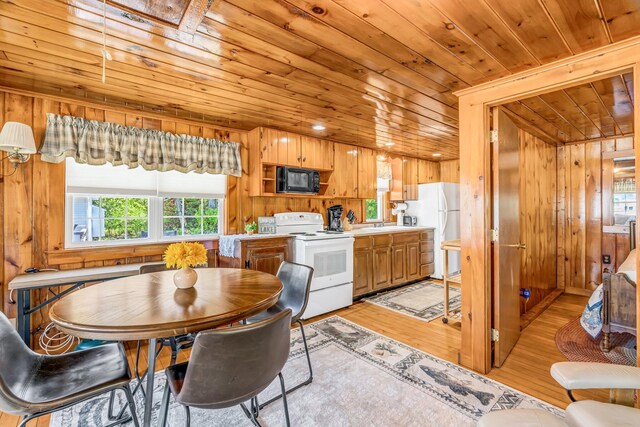 117 Pinkhams Cove Rd, Belgrade, ME 04917 - dining room featuring wooden ceiling, light wood-style flooring, and wooden walls