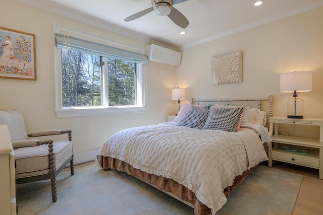 bedroom featuring a wall mounted AC, crown molding, recessed lighting, baseboards, and wood finished floors