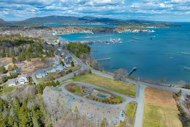 aerial view of property's location featuring a water and mountain view