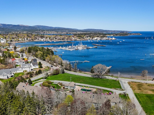 aerial view of property's location with a water and mountain view