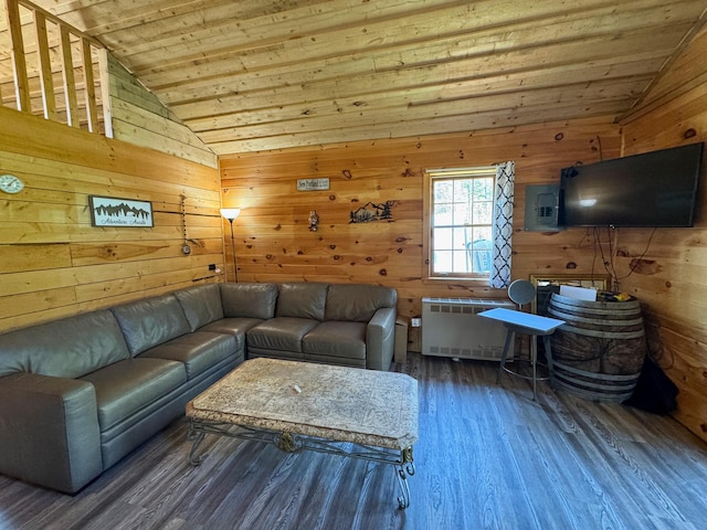 living area with vaulted ceiling, wooden ceiling, wood finished floors, wood walls, and radiator
