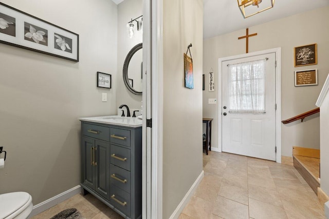 107 Elm St, South Portland, ME 04106 - bathroom with toilet, vanity, and baseboards