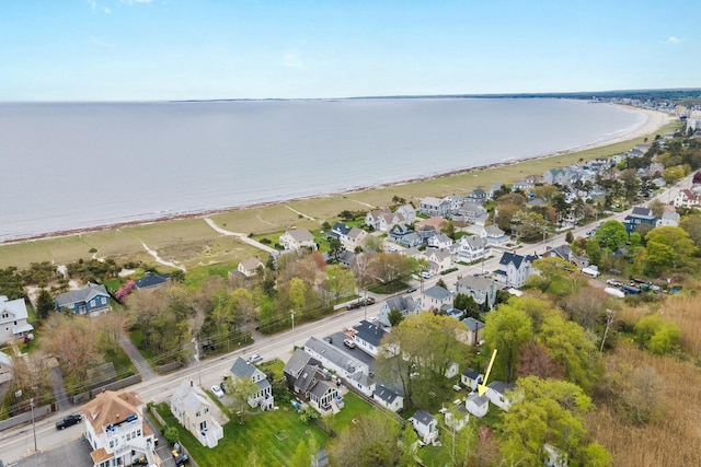 aerial overview of property's location featuring nearby suburban area and a nearby body of water
