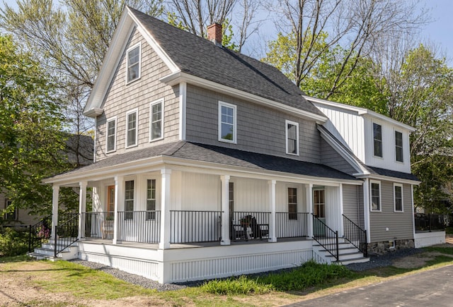104 Woodbridge Rd, York, ME 03909 - view of front of home with a porch, a shingled roof, and a chimney