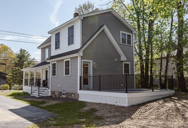 104 Woodbridge Rd, York, ME 03909 - view of property exterior with a chimney and a shingled roof