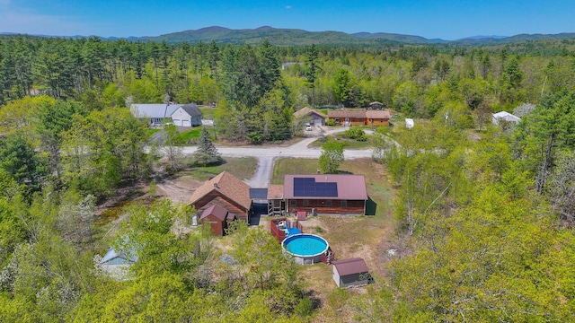 19 Pine Acres Dr, Cornish, ME 04020 - view from above of property featuring a heavily wooded area, a pool area, and a mountainous background