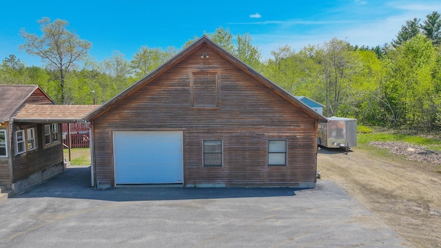 19 Pine Acres Dr, Cornish, ME 04020 - garage featuring asphalt driveway