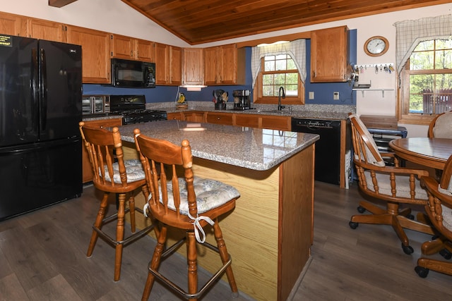 19 Pine Acres Dr, Cornish, ME 04020 - kitchen featuring black appliances, lofted ceiling, wooden ceiling, brown cabinetry, and a kitchen island