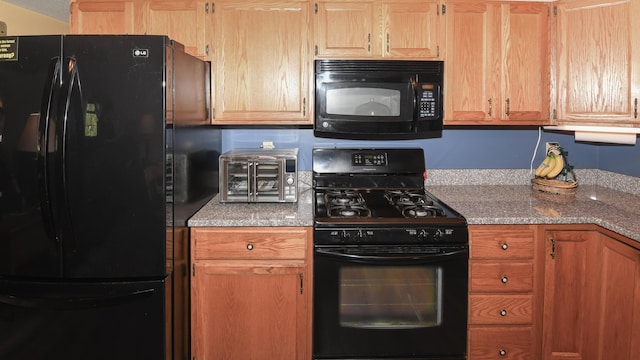 19 Pine Acres Dr, Cornish, ME 04020 - kitchen featuring black appliances and light stone countertops