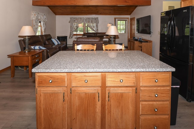 19 Pine Acres Dr, Cornish, ME 04020 - kitchen with freestanding refrigerator, dark wood finished floors, light stone counters, and wood ceiling