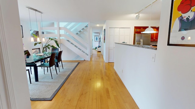 28 Meadow Ln, Brewer, ME 04412 - hall featuring track lighting, stairs, and light wood-style flooring