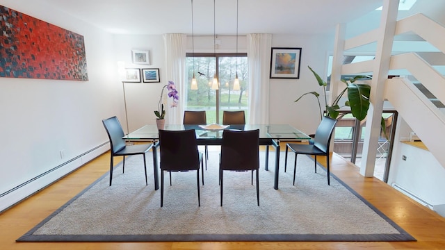 28 Meadow Ln, Brewer, ME 04412 - dining room featuring baseboard heating and wood finished floors