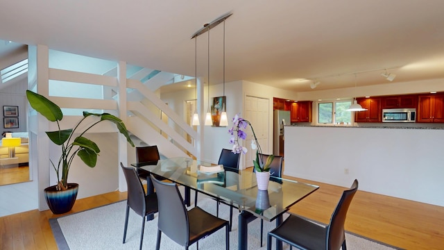 28 Meadow Ln, Brewer, ME 04412 - dining room with light wood-style flooring and stairway