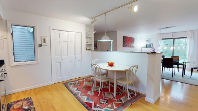 28 Meadow Ln, Brewer, ME 04412 - dining room with track lighting, wood finished floors, and baseboards