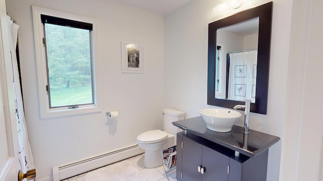 28 Meadow Ln, Brewer, ME 04412 - bathroom with a baseboard radiator, vanity, toilet, and healthy amount of natural light