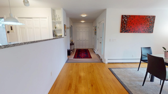 28 Meadow Ln, Brewer, ME 04412 - hall featuring baseboard heating and light wood finished floors
