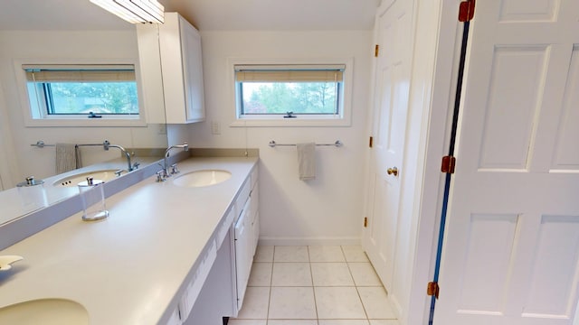 28 Meadow Ln, Brewer, ME 04412 - bathroom with double vanity, tile patterned flooring, and baseboards
