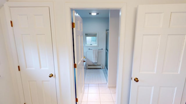 28 Meadow Ln, Brewer, ME 04412 - corridor featuring a baseboard heating unit, light tile patterned flooring, and baseboards